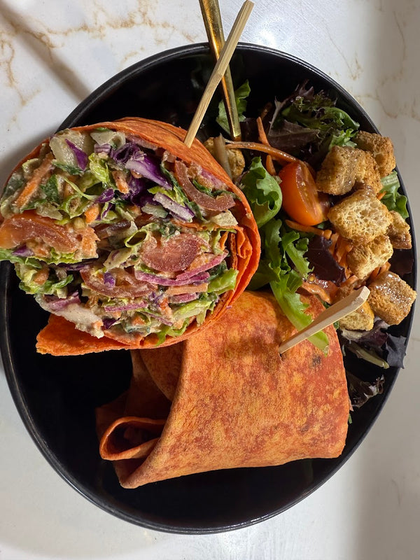 Garden Grove wrap with side salad at Golden Juicery Jupiter