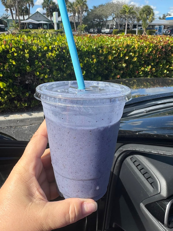 Stormy Sea purple smoothie in a clear cup at Golden Juicery Tequesta