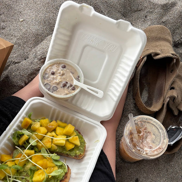 Avocado toast and smoothie on the beach near Golden Juicery